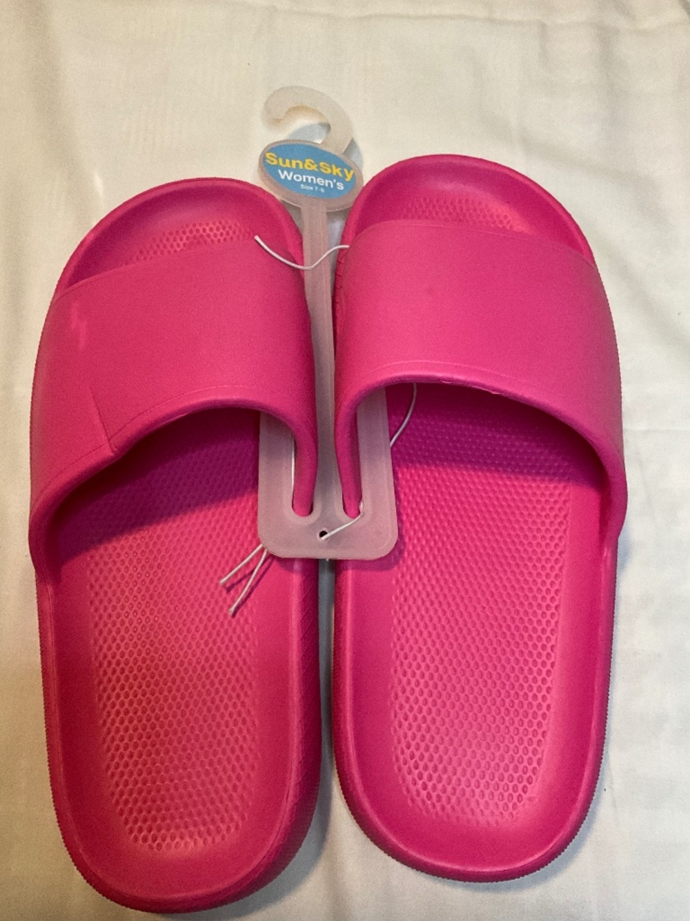 These‎ are pink Sun & Sky Women's slip-on sandals.